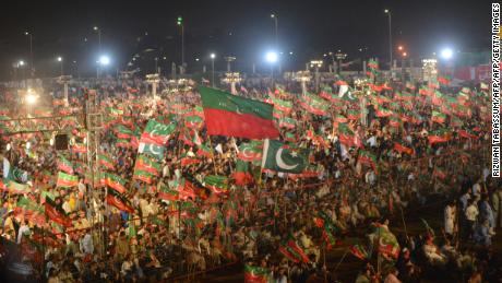   Supporters of the Pakistani cricketer turned into politician Imran Khan of Tehreek-e-Insaf (Movement for Justice) while they attend an election campaign organized by Khan before the Karachi general election July 22, 2018. 