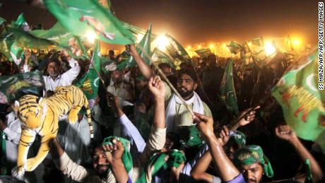   Supporters of Shahbaz Sharif, the younger brother of Pakistan's ousted Prime Minister Nawaz Sharif and leader of the Pakistani Muslim League-Nawaz (PML-N), chant slogans and flags during an election campaign in Pakistan. July in Multan Supporters of Shahbaz Sharif, the younger brother of ousted Pakistani Prime Minister Nawaz Sharif and leader of the Pakistani Muslim League-Nawaz (PML-N), chant slogans and vague flags at a meeting of campaign before the general election. in Multan on July 22, 2018. 