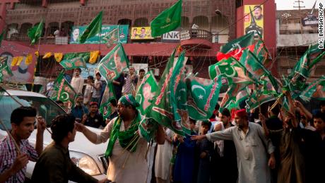   People gather in front of a polling station of a candidate Wednesday, the polls ended in Rawalpindi 