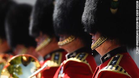 A bead of sweat falls from a member of the Queen&#39;s Guard during the changing of the guard at Wellington Baracks in London.
