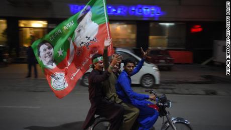   Supporters of Pakistani politician, Imran Khan, celebrate in Rawalpindi on July 25, 2018. 