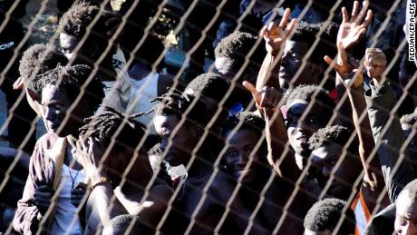   Several migrants celebrate in Ceuta after successfully crossing the border between Spain and Morocco. 