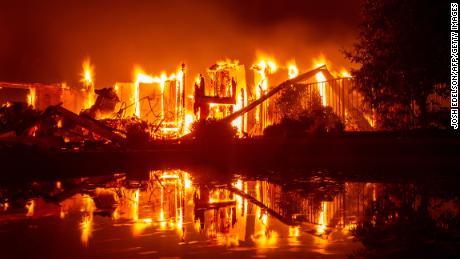   The Flames engulf a house in Redding, California. 