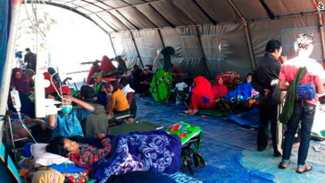 Earthquake survivors receive medical treatment at a temporary shelter in Sembalun, East Lombok, on Monday.