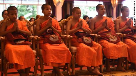 Members of the Wild Boars soccer team at a ceremony to mark the end of their retreat as novice Buddhist monks.