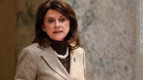 State Sen. Leah Vukmir stands in the Senate chambers at the state Capitol in Madison, Wis.