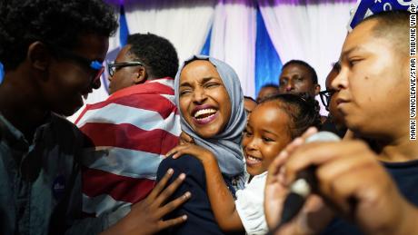 Minnesota Rep. Ilhan Omar, center, celebrates with her children after her Congressional 5th District primary victory.