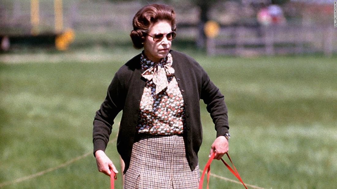 Elizabeth walks with some of her corgis at the Windsor Horse Trials in May 1980.