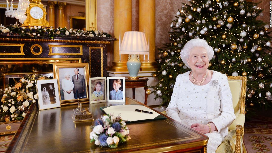 The Queen sits at a desk in Buckingham Palace after recording her Christmas Day broadcast in 2017.
