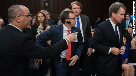 Fred Guttenberg, father of Parkland, Florida, shooting victim Jaime Guttenberg, tries to speak with then-Judge Brett Kavanaugh as he leaves for a break during his Senate confirmation hearing in 2018.
