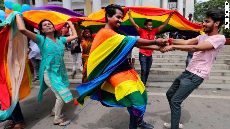 Members of India&#39;s LGBT community dance in celebration after the ruling was announced in Bangalore on Thursday.