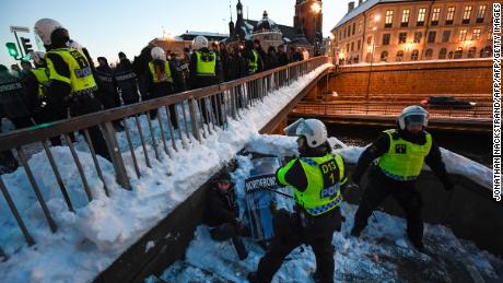 Police separate demonstrators in  Stockholm in November 2016 after a protest against migrants. 