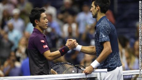 Nishikori and Djokovic shake hands following their men&#39;s singles semifinal match.