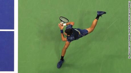 Novak Djokovic stretches during the US Open final Sunday. 