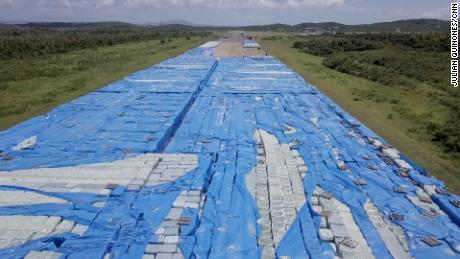 Batteries on bottled water stacks are installed near a track in Ceiba this month.