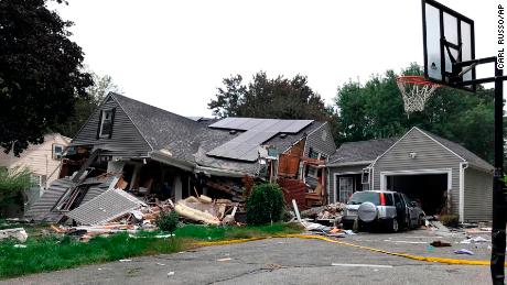A home in Lawrence is reduced to most rubble Thursday after a series of explosions.