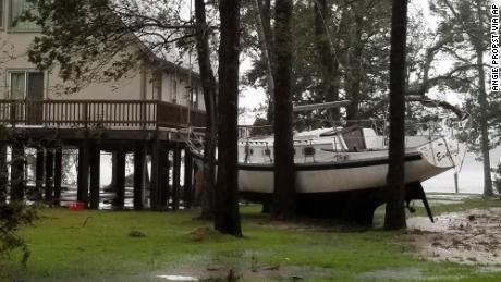 A boat is stuck in trees Friday in Oriental, North Carolina, on a photo of Angie Propst.