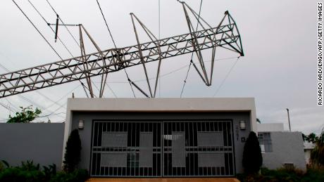 A hurricane-spilled power tower is still on a house in San Juan, Puerto Rico, November 7, 2017.