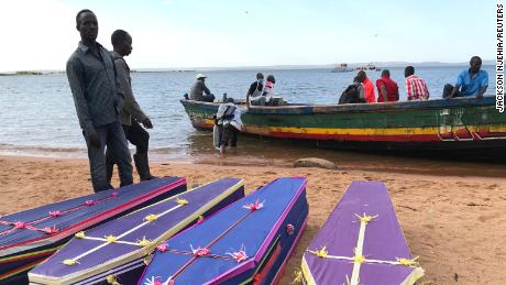 Volunteers organize coffins for passengers killed when the ferry capsized. 