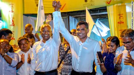 Maldives & # 39; The presidential contender candidate, Ibrahim Mohamed Solih, and his running mate, Faisal Naseem, celebrate their presumed victory in the presidential election.