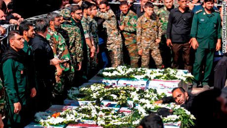 Iranian army members are crying at the public funeral of the victims of the attack in Ahvaz.