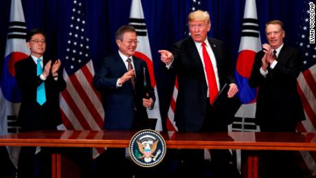 South Korean leader Moon Jae-In and President Donald Trump on Monday celebrate a trade signature pact.