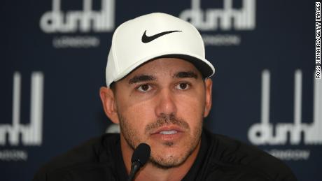 Brooks Koepka talks with reporters in St. Andrews.