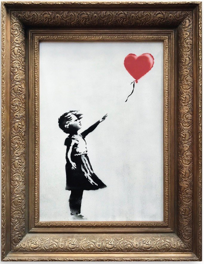 Schatting Oprichter spel Banksy painting 'self-destructs' moments after being sold for $1.4 million  - CNN Style