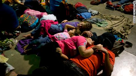 Honduran migrants sleep at an improvised shelter in Esquipulas, Guatemala, on Monday.