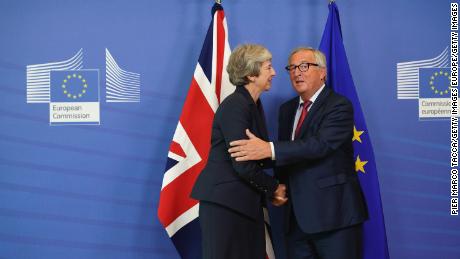European Commission President Jean-Claude Juncker shakes hands with British Prime Minister Theresa May.