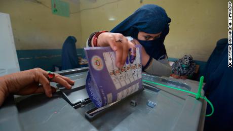 A woman casts her vote at a polling station in Jalalabad, the capital of Afghanistan&#39;s eastern Nangarhar province.