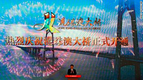 On October 23, 2018, Chinese President Xi Jinping applauds on the stage after the official opening of the China-Zhuhai-Macau-Hong Kong Bridge