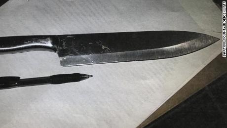 Two of the knives had blades of at least 5 or 6 inches, police photos show. 