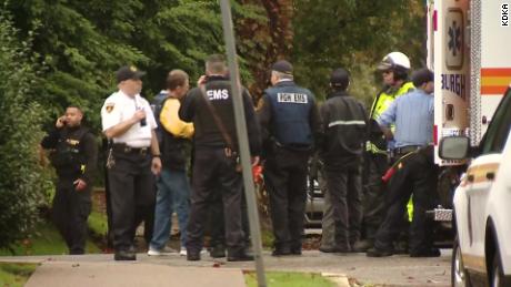 Officials near the scene of a shooting in Pittsburgh&#39;s Squirrel Hill neighborhood. 