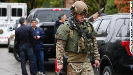 Members of the security forces respond to the shooting scene of the synagogue in Pittsburgh on Saturday.