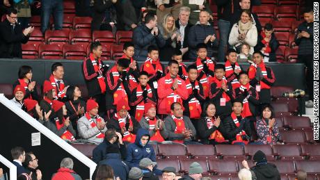 Members of & # 39; Wild Boars & # 39; The football team attended a Premier League game between Manchester United and Everton FC at Old Trafford Stadium in October 2018.