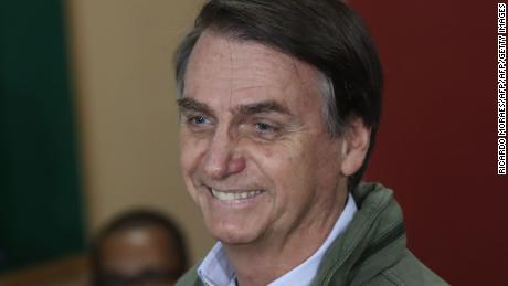 Brazil's right-wing presidential candidate for the Social Liberal Party (PSL), Jair Bolsonaro votes during runoff elections, in Rio de Janeiro, Brazil, on October 28, 2018. (Photo by RICARDO MORAES / POOL / AFP)RICARDO MORAES/AFP/Getty Images