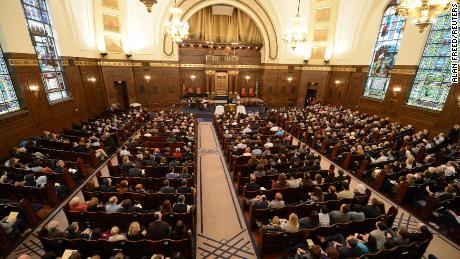 Congregants of various faiths gather Friday with the Rodef Shalom congregation in Pittsburgh. 