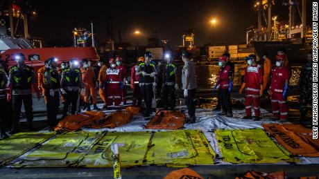 Body bags are laid out at Jakarta&#39;s Tanjung Priok port on November 3.