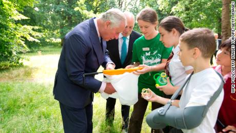 Charles inspects insects with students at the launch of a new association last year in London, Hyde Park. 