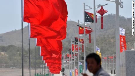 A Chinese worker gives instructions on November 13 for the final touches to decorations in Chinese President Xi Jinping's preparation and welcoming ceremony in Port Moresby.