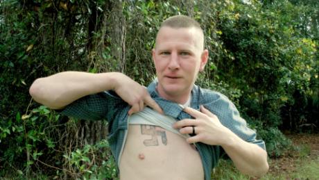 Ken Parker reveals a swastika that he had tattooed on his chest when he was involved in the neo-Nazi movement. 