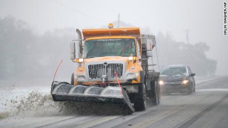 A plow removes snow from Douglas County, Kansas, on Sunday.