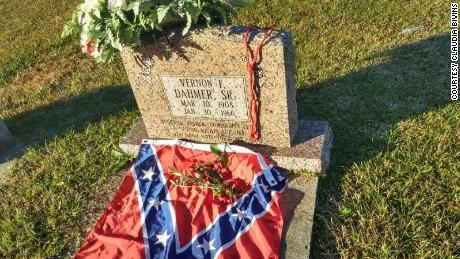 Bivins said he placed the flag on Vernon Dahmer's grave as a gesture of hope for the end of racism.