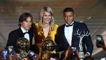 Hegerberg poses with Luka Modric (left), the men&#39;s 2018 Ballon d&#39;Or winner, and Kylian Mbappe, the  under-21 Ballon d&#39;Or (Koppa trophy) winner.