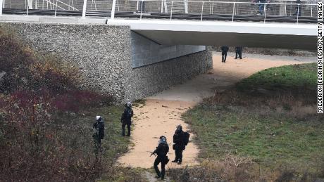 French special forces  search a bank of the River Rhine in Strasbourg on Wednesday as they hunt the gunman.