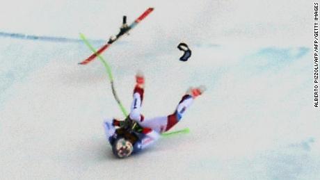 Switzerland&#39;s Marc Gisin slid down the Saslong piste on his back and side after a nasty crash just before the &#39;camel hump&#39; section of the downhill course.  