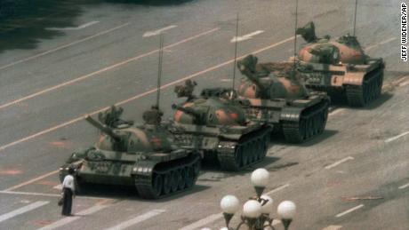 A Chinese man stands alone to block a line of tanks heading east on Beijing&#39;s Cangan Blvd. in Tiananmen Square on June 5, 1989.