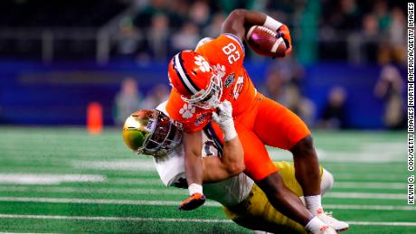 Drue Tranquill of the Notre Dame Fighting Irish tackles Clemson Tigers&#39; Tavien Feaster in the second half during the College Football Playoff Semifinal Goodyear Cotton Bowl Classic.