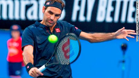 Switzerland&#39;s Roger Federer hits a return against Cameron Norrie of Britain during their men&#39;s singles match on day two of the Hopman Cup.